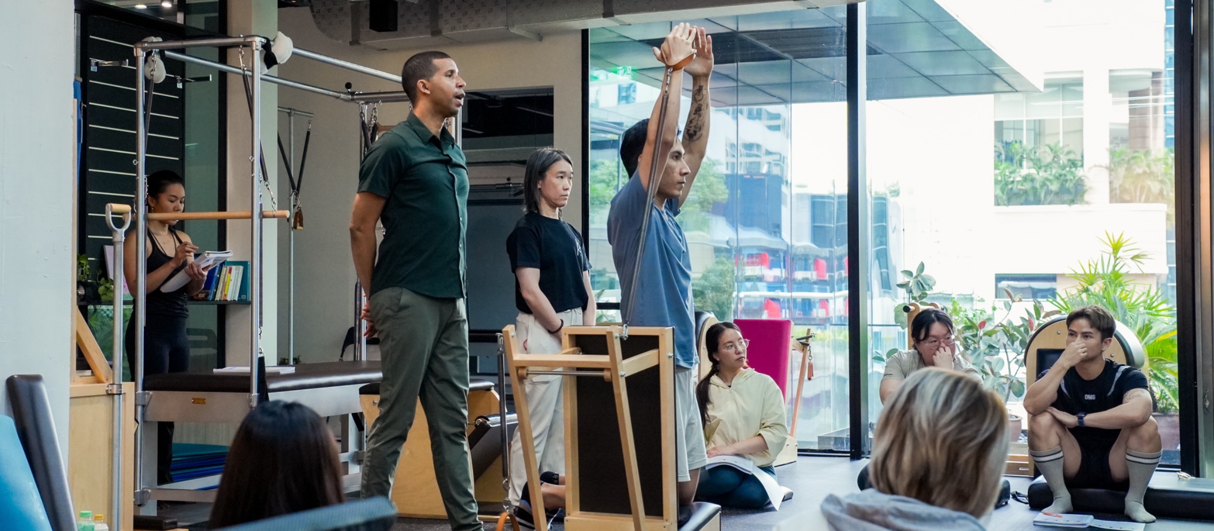 Classical Pilates teacher training session at RM58 — apprentices observing and practicing